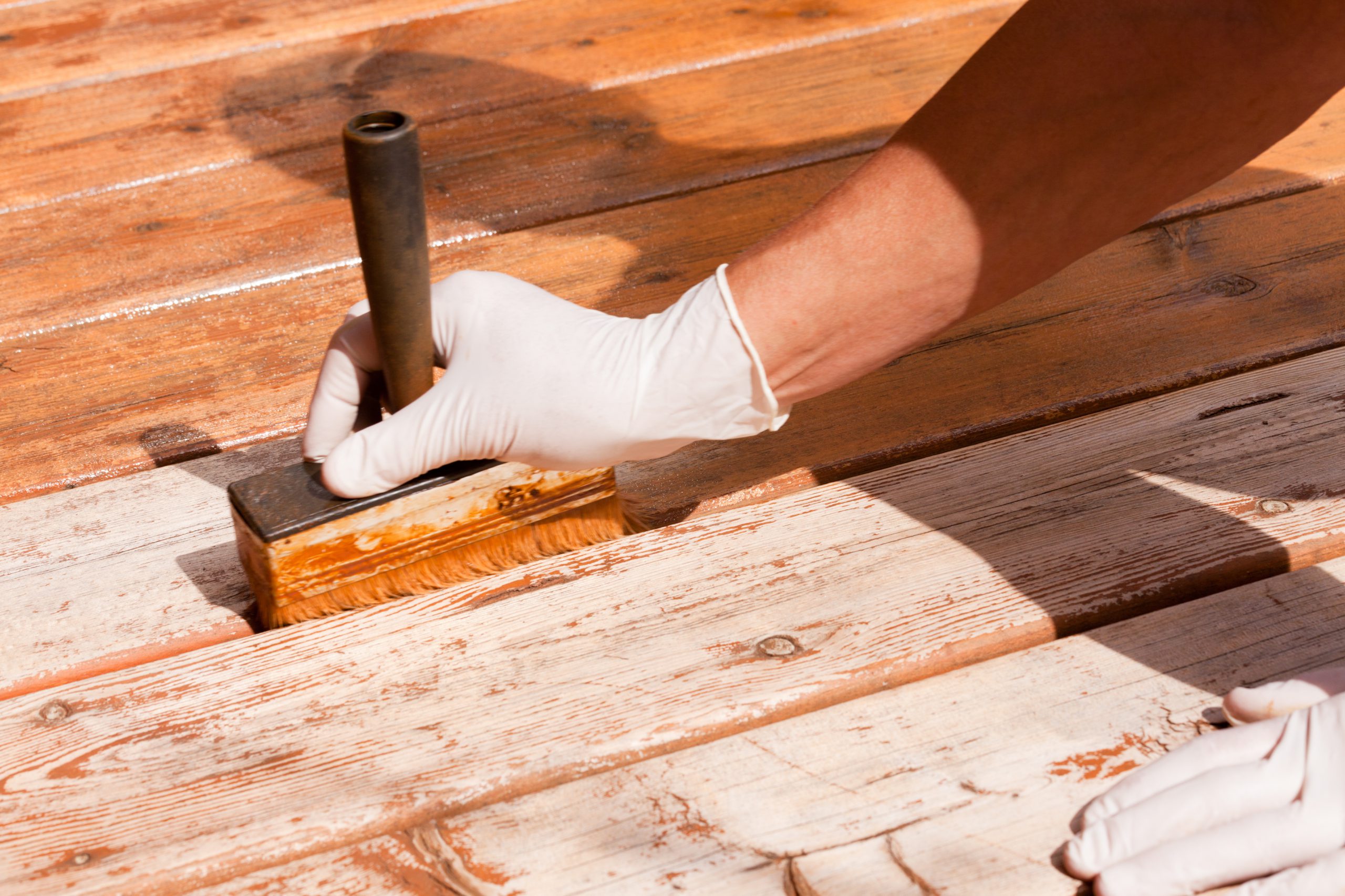Deck maintenance apply stain on wooden decking Orland Park